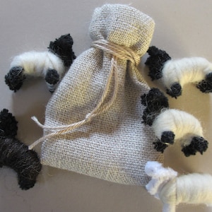 Worry sharing sheep in a natural Linen draw string bag