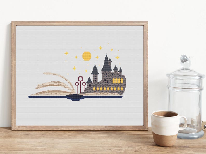 May include: A cross-stitch pattern featuring a gray castle with yellow windows, a yellow moon, and stars. The castle is on an open book with red wands.