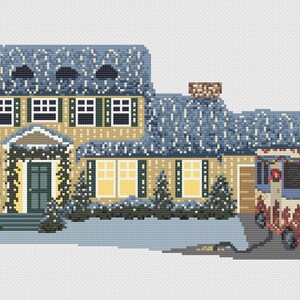 May include: A yellow house with a blue roof and snow on the roof. The house has a green door and windows. There are Christmas lights on the house and a Christmas tree in the window. A blue bus with Christmas lights and a wreath is parked in the driveway.