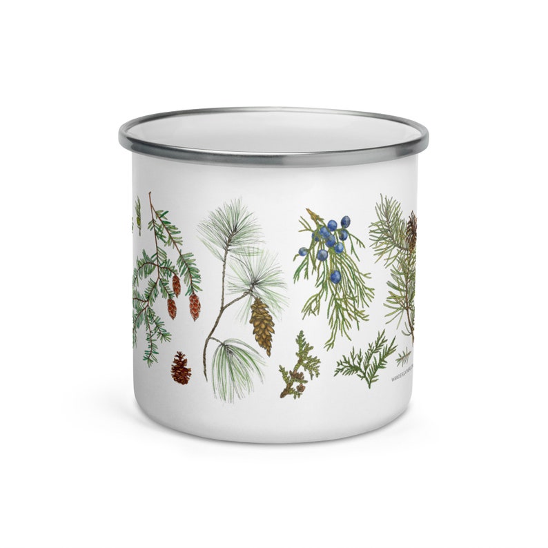 May include: White enamel mug featuring a design of pine branches, pine cones, and juniper berries. The design is in shades of green, brown, and blue.