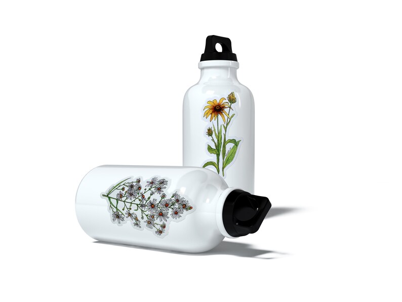 May include: Two white aluminium water bottles with floral designs. One bottle has a yellow flower with green leaves and the other bottle has white flowers with green leaves.