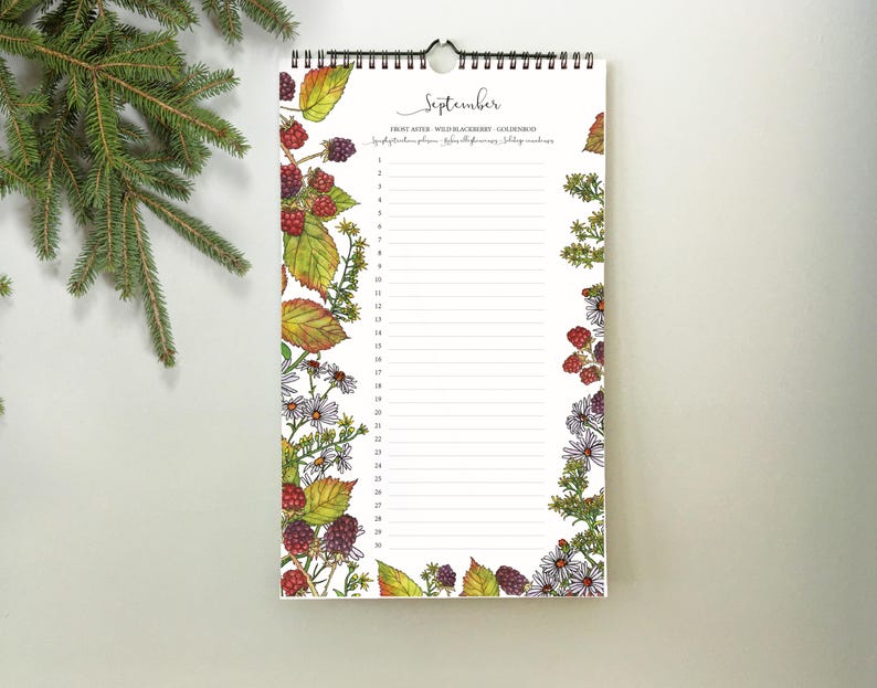 May include: A spiral-bound calendar for September, featuring a white background with a floral and berry border. The calendar has a list format with lines for each day. The top of the calendar reads "September" in cursive.