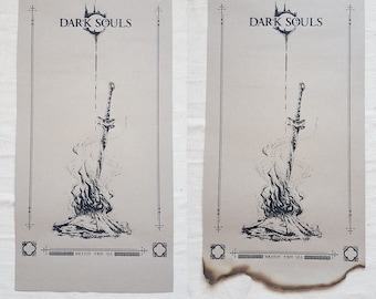 May include: Two Dark Souls posters, one with a burnt edge. Both posters feature a sword in a bonfire with the text "DARK SOULS" at the top.
