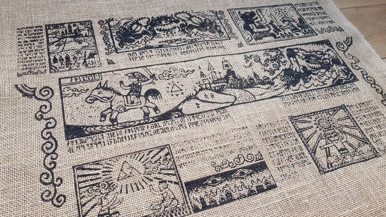 May include: A burlap fabric tapestry with black ink illustrations of a knight riding a horse, a castle, and other fantasy scenes. The tapestry has a border of decorative swirls.
