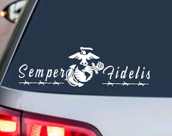 May include: White vinyl decal with the Marine Corps emblem and the words "Semper Fidelis" on a blue car window.