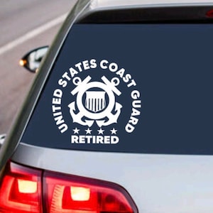 May include: White vinyl decal of the United States Coast Guard emblem with the words "United States Coast Guard Retired" on a blue car window.