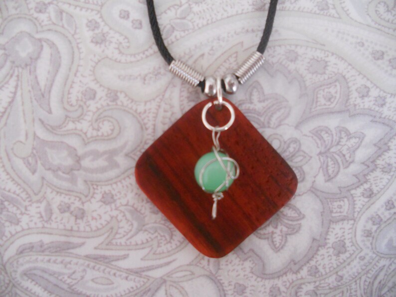 Exotic Wood Padauk Pendant. Green Wrapped Glass Beads image 0