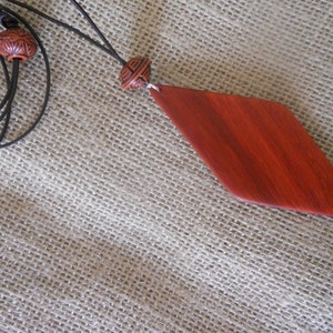 Exotic Wood Padauk Pendant. Double Sided Portable Red Wooden Jewelry Necklace.Handcrafted Necklace Wooden Art. Women's necklace. image 4