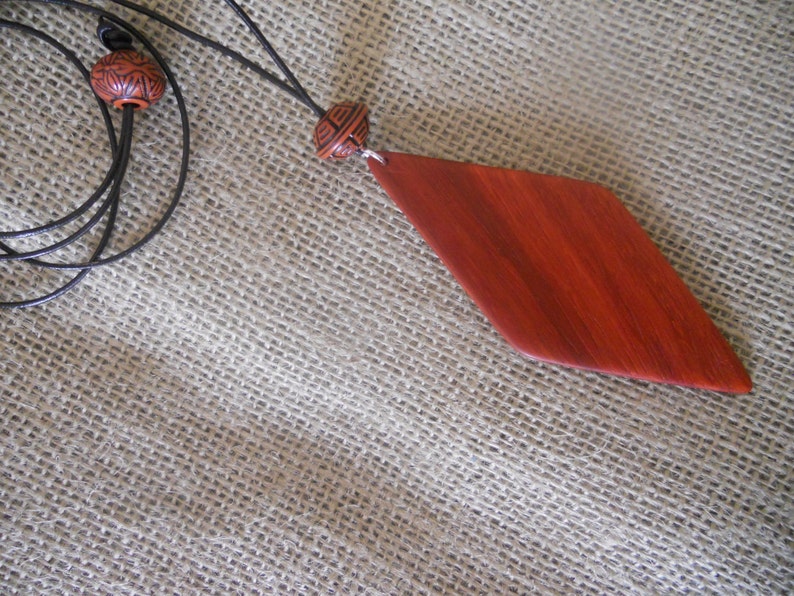 Exotic Wood Padauk Pendant. Double Sided Portable Red Wooden Jewelry Necklace.Handcrafted Necklace Wooden Art. Women's necklace. image 4