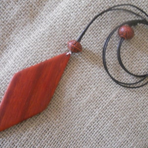 Exotic Wood Padauk Pendant. Double Sided Portable Red Wooden Jewelry Necklace.Handcrafted Necklace Wooden Art. Women's necklace. image 3