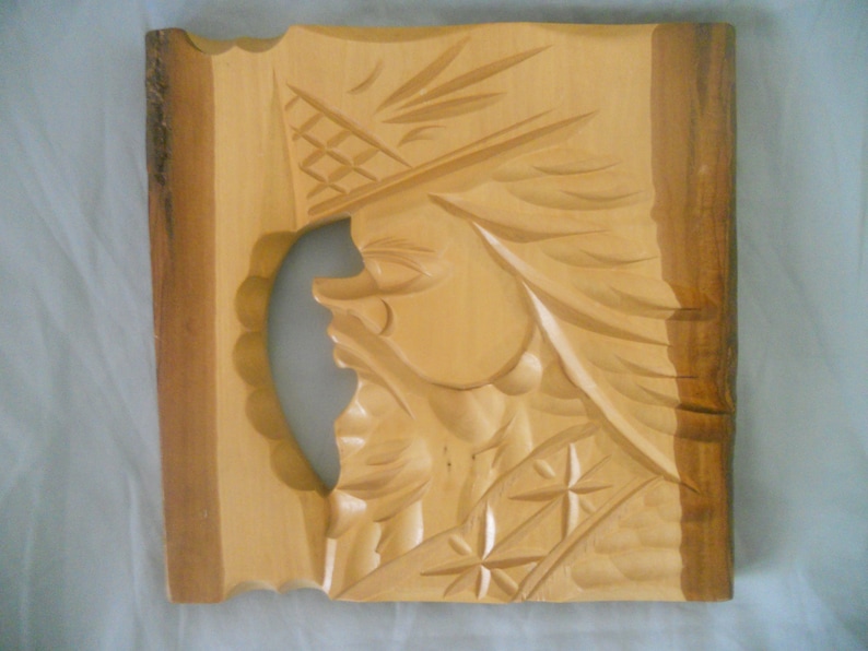 Wood Carving Face by Ainu people. Tribal Wood Carving. Made in image 0