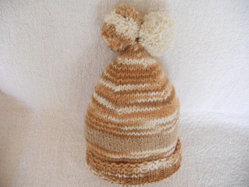 Hand Knitted Baby Hat. Unisex with two pompoms. Natural Wool image 0