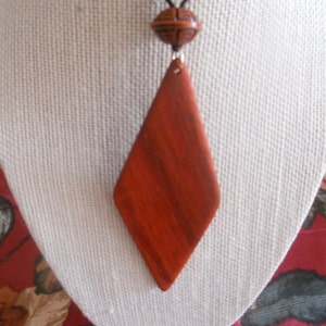 Exotic Wood Padauk Pendant. Double Sided Portable Red Wooden Jewelry Necklace.Handcrafted Necklace Wooden Art. Women's necklace. image 5