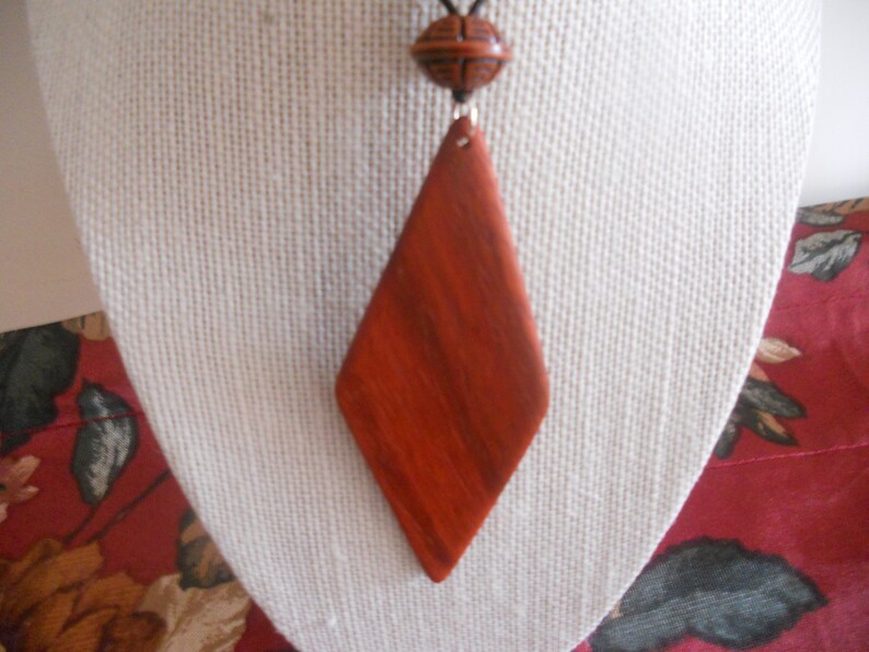 Exotic Wood Padauk Pendant. Double Sided Portable Red Wooden Jewelry Necklace.Handcrafted Necklace Wooden Art. Women's necklace. image 5