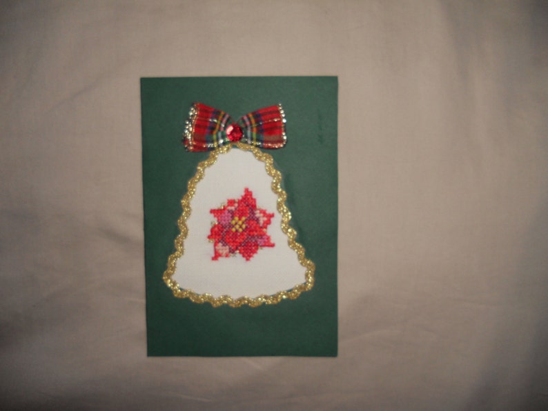 New Year's Greeting Card Bell. Christmas card. Cross image 0