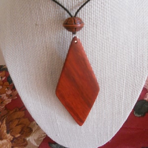 Exotic Wood Padauk Pendant. Double Sided Portable Red Wooden Jewelry Necklace.Handcrafted Necklace Wooden Art. Women's necklace. image 1