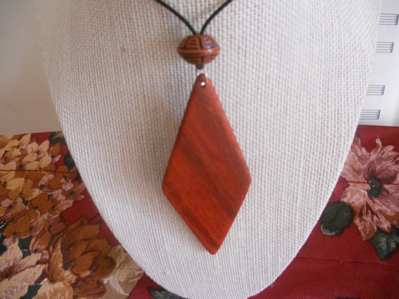 Exotic Wood Padauk Pendant. Double Sided Portable Red Wooden Jewelry Necklace.Handcrafted Necklace Wooden Art. Women's necklace. image 1