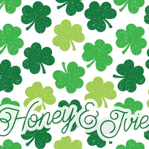May include: A white background with a repeating pattern of green shamrocks. The text "Honey & Trie" is written in a green cursive font.