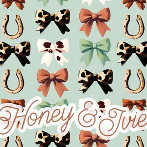 May include: A repeating pattern of bows, horseshoes, and the text "Honey & Ivie" on a light blue background. The bows are in various colors and patterns, including leopard print, white with brown spots, and solid colors.