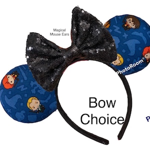 May include: Black sequin bow headband with blue fabric mouse ears featuring a Harry Potter themed print with characters and magical objects. The text "Magical Mouse Ears" is visible on the headband.