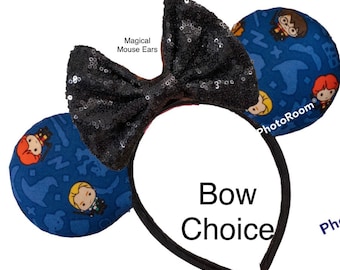 May include: Black sequin bow headband with blue fabric mouse ears featuring a Harry Potter themed print with characters and magical objects. The text "Magical Mouse Ears" is visible on the headband.