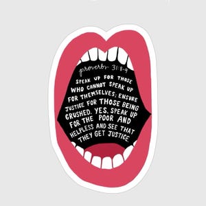 May include: A sticker featuring a stylized open mouth with red lips and white teeth. Inside the mouth, black text quotes Proverbs 31:8-9, advocating for justice and speaking up for the vulnerable. The sticker has a white border.