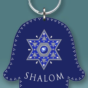 May include: A blue Hamsa hand keychain with a silver Star of David and the word "SHALOM" in white lettering.