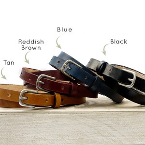 Belts come in reddish brown, tan, black, or blue leather color options.