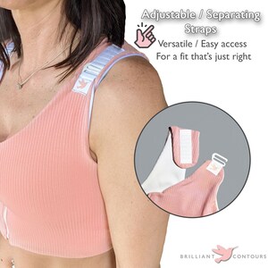 May include: A pink sports bra with adjustable straps that can be separated. The straps have white accents and a small bird logo. The text "Adjustable / Separating Straps" is above the image. The text "Versatile / Easy access" is below the image. The text "For a fit that's just right" is below the text "Versatile / Easy access". The text "BRILLIANT CONTOURS" is below the image.