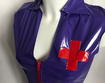 May include: Purple sleeveless vinyl dress with a red cross on the chest and a red zip down the front.
