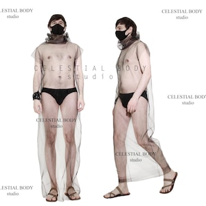 Puede incluir: Dos personas con vestidos de malla negra transparente y mascarillas faciales negras. Los vestidos son largos y fluidos, y las personas están de pie con las piernas ligeramente separadas. El texto "CELESTIAL BODY studio" está impreso en los vestidos.