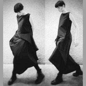 Avant-garde black dress. Extravagant dress. Asymmetrical dress.