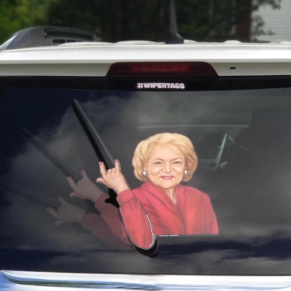 Betty White WiperTag decal and arm attach to rear vehicle wiper blades. Detachable, interchangeable, and weather resistant. Made in the USA.
