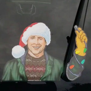 Light it Up Christmas Vacation WiperTags decal and arm attach to rear wiper blades. Detachable, interchangeable, and weather resistant.