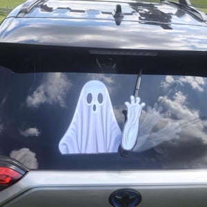 Boo Waving Ghost WiperTag decal and arm attach to rear vehicle wiper blades. Detachable, interchangeable, weather resistant. Made in the USA