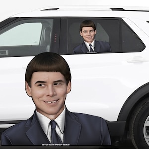 May include: A cardboard cutout of a man with a distinctive bowl haircut, wearing a dark suit and tie, is positioned in front of a white SUV. A smaller version of the cutout is visible inside the car, creating a humorous effect. The cutout is designed to look like a passenger.
