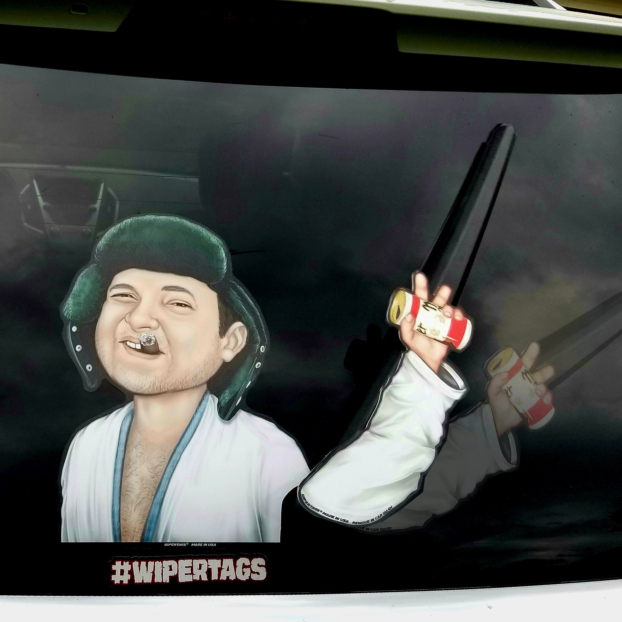 Eddie waving a beer Christmas WiperTags attach to rear vehicle wiper blades. Detachable, interchangeable, weather resistant. Made in the USA