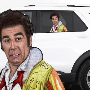 May include: A car window sticker featuring a cartoon image of a man with brown hair wearing a yellow and red jacket. The sticker is placed on the back window of a white car.