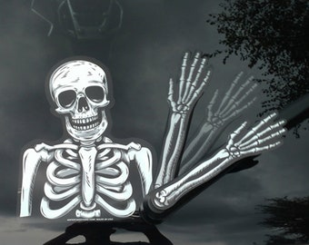 May include: A white skeleton with a ribcage and a skull is shown on a black background. The skeleton has two arms that are outstretched and appear to be waving. The skeleton is a Halloween decoration.