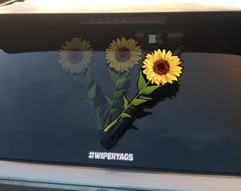 Sunflower WiperTags attach to rear vehicle wiper blades. For SUVs and minivans. Detachable, interchangeable, weather resistant. Made in USA.