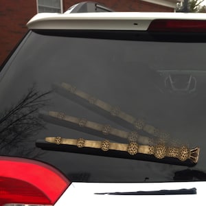 Deathstick Wand WiperTags attach to rear vehicle wiper blades. Detachable, interchangeable, and weather resistant. For vans, SUV, hatchbacks