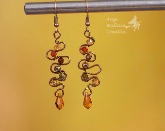 Asymmetrical, rustic copper wire wrapped earrings with  Swarovski crystals on aged copper ear hooks