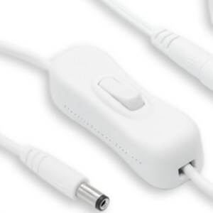 May include: White inline on/off switch with a white cord and a white plug. The switch has a small white button. The text "Electric Crown. Etsy.com" is printed on the switch.