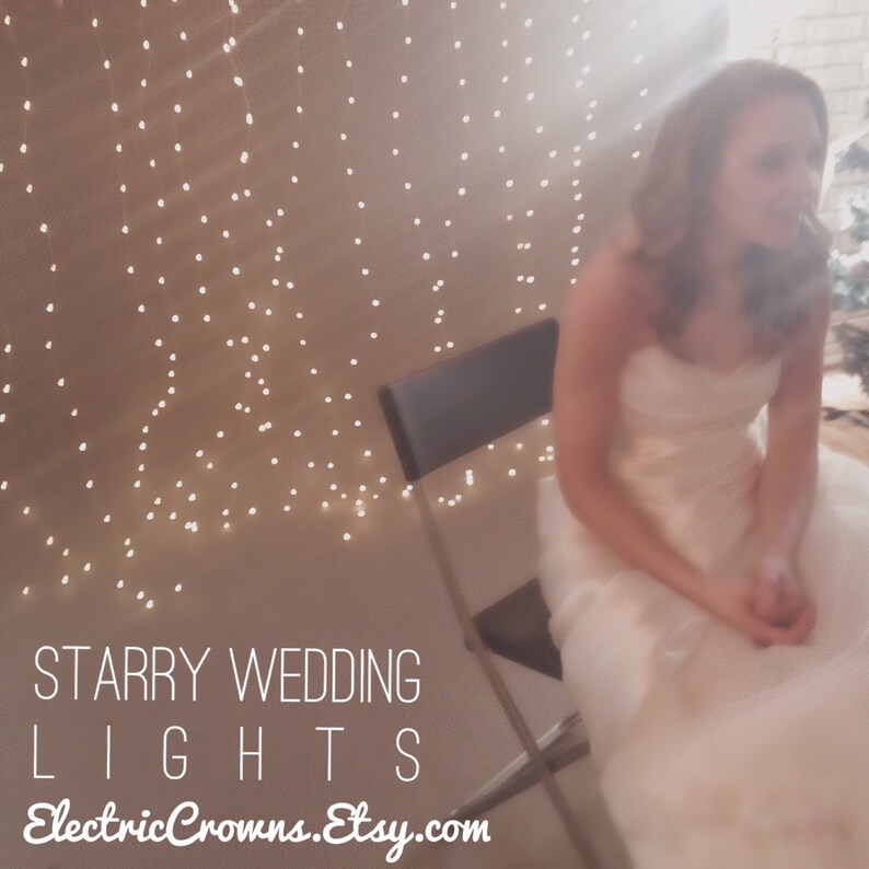 May include: A bride sits in a chair in front of a wall decorated with white fairy lights. The text "Starry Wedding Lights ElectricCrowns.Etsy.com" is at the bottom of the image.