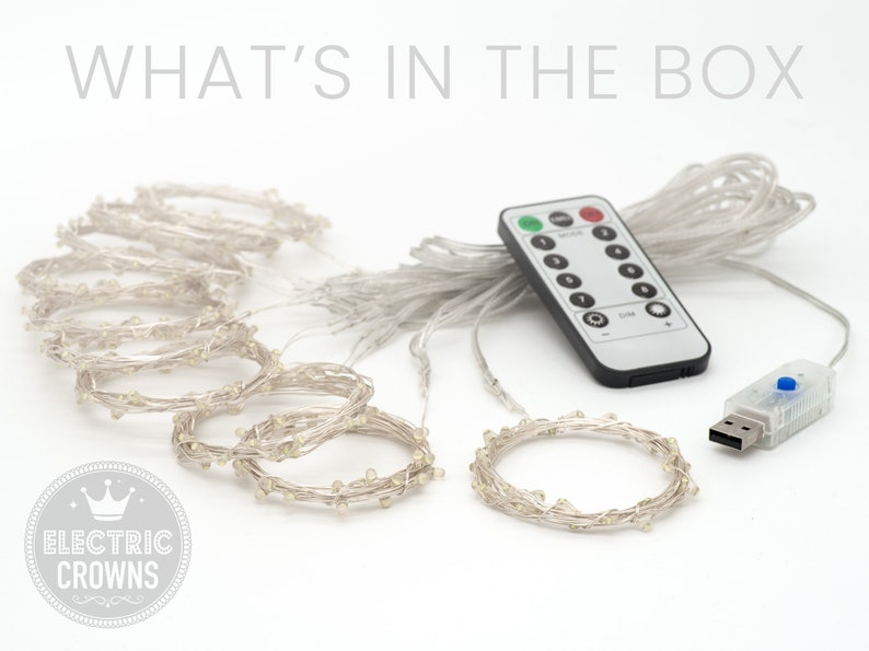 May include: A set of white LED fairy lights with a remote control and USB adapter. The lights are strung together in a long strand and can be used to decorate a home or party.