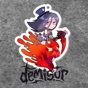 May include: A black and white illustration of a character with purple hair wearing a black and white outfit and a top hat riding a red skull with a scythe. The text "DEMISUR" is below the character.