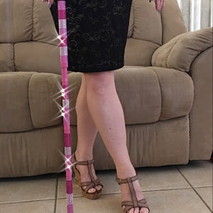 Unique Pink bling Walking Cane. Three shades of pink bling. Adjustable. Sparkly, one of a kind item! Perfect for the opera, evening out.