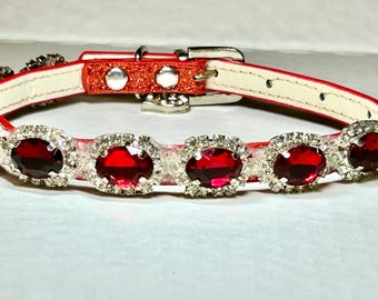 Red rhinestones adorn this sparkling Small dog collar. Circled by small glass diamonds! Elegant and photo worthy. Eye catching. Scarlet gems