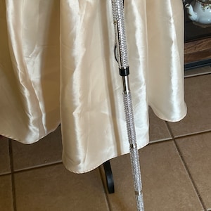 Silver Metal Cane with Silver faux Rhinestone Bling. Folding and Adjustable. Perfect gift for a loved one.