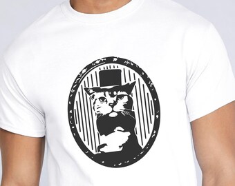 May include: A white t-shirt with a black and white graphic of a cat wearing a top hat and a mustache. The cat is inside a circle with a striped background.